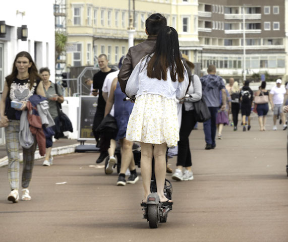 Electric scooters riding shotgun on promenade © Russell Jacobs