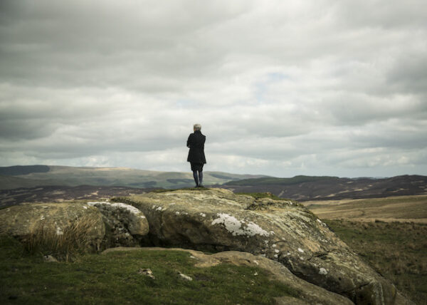 Janet looking out over Otterburn Ranges, Northumberland National Park. A Military range where the army suspends activity during lambing season © Zoe Childerley
